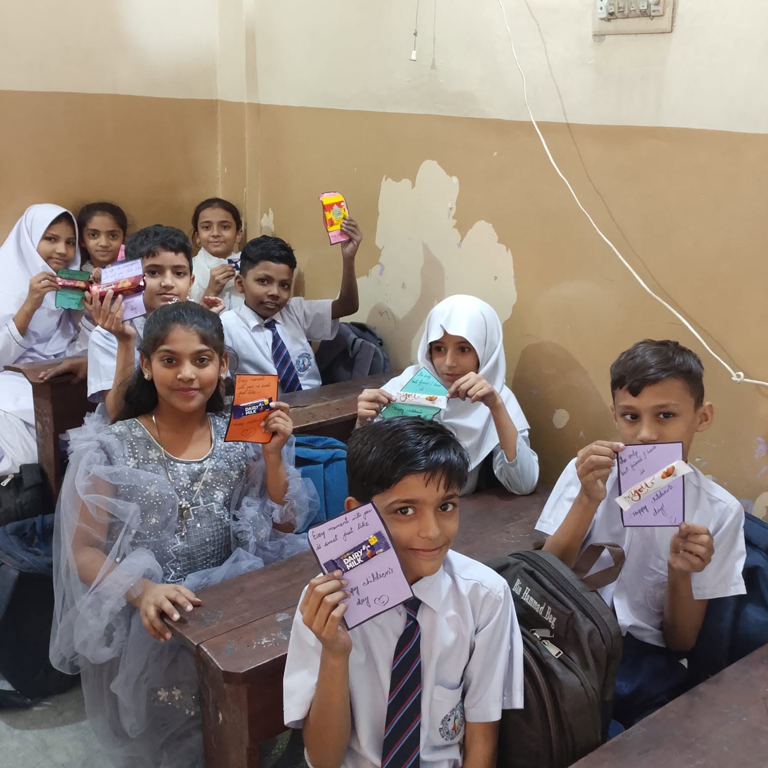Students with Children's Day cards and chocolates