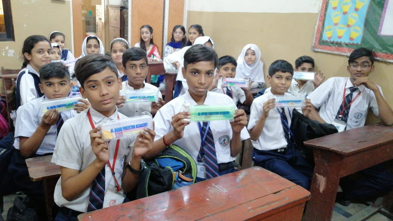Students receiving pencil cases